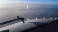 Oncoming Aircraft Passes Beneath Plane