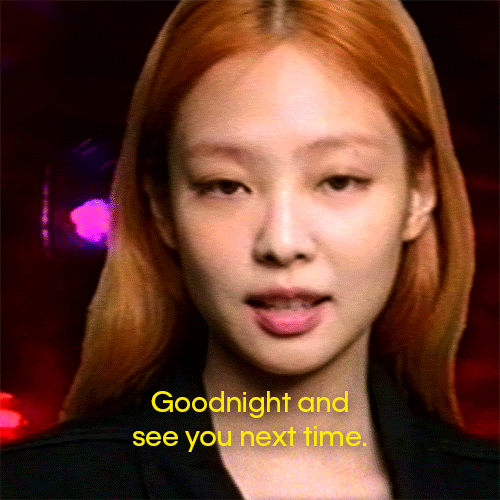 Video gif. Jennie from Blackpink tilts back her head with a confident expression and says, "Goodnight and see you next time" as neon red lights flash behind her.