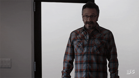 marc maron shrug GIF by IFC