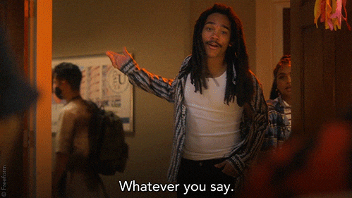 TV gif. Luka Sabbat as Luca Hall in Grown-ish holds an arm out as he exits a room backwards, looking at us and saying, “Whatever you say.”