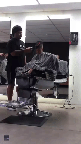 Short Back and Snooze: Boy Nods Off in Barber's Chair
