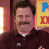 Parks and Recreation gif. Nick Offerman as Ron Swanson laughing and raising an eyebrow.
