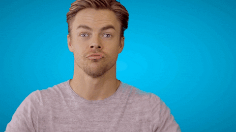 Celebrity gif. Derek Hough purses his lips and enthusiastically gives us two big thumbs up.