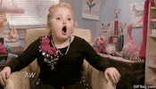 Reality TV gif. A young Alana "Honey Boo Boo" Thompson from Here Comes Honey Boo Boo rolls her eyes back and forth as she says "Awesome!"
