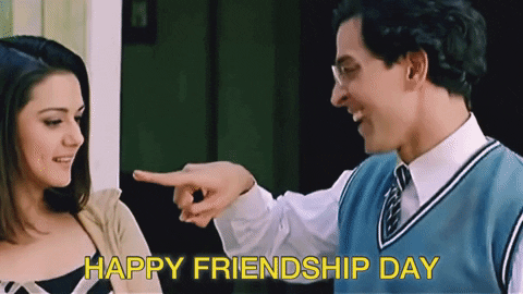 Movie gif. Hrithik Roshan as Rohit in "Koi... Mil Gaya" grins as he performs a secret handshake with Preity Zinta as Nisha, who also smiles. Text, "Happy Friendship Day."