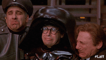 Movie gif. The cast from Spaceballs all huddle together with their eyes closed before looking up in relief. They say, "Thank you!" in unison before huddling back together.