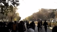Protesters Throw Rocks at Police in Tehran