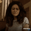 TV gif. Emmy Rossum as Fiona in Shameless frowns in disgust while slowly backing up.