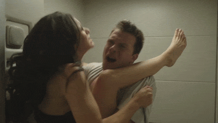Video gif. A man has a girl up on a bathroom sink with one of her legs over his shoulder. They have violent intercourse as he yells at her.  