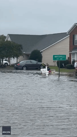 Man Kayaks Down Flooded Road After Storm Ophelia Hits North Carolina