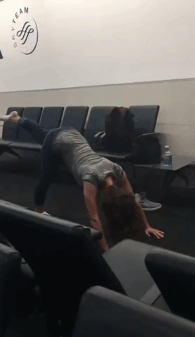 Little Girl Does Yoga While Waiting for Flight