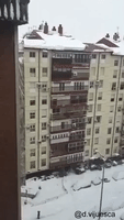 Slow-Mo Snow Falls From Roof in Storm-Hit Madrid Suburb