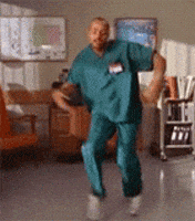 TV gif. Turk played by Donald Faison from Scrubs ecstatically doing a joyous happy dance in celebration.