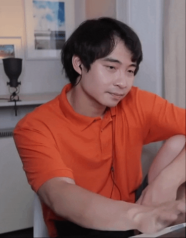 Video gif. Man sits with his arm resting on his knee as he looks at his computer screen. He smirks disappointedly and shakes his head.