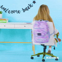 Ad gif. An ad for Kohl's back to school sale. A young woman sits in front of a desk and has a backpack on the back of her seat. She spins around, flashing us a grin and a double thumbs up.