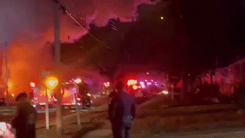 Smoke Billows Into Night Sky After House Explosion in Flint Suburb