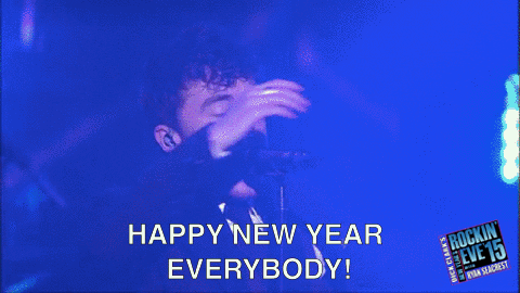 TV gif. On stage at New Year’s Rockin’ Eve, Jake Roche of Rixton yells into the microphone happily, “Happy new year, everybody!”