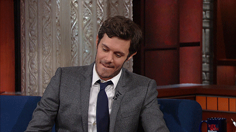 TV gif. While being interviewed on the Late Show with Stephen Colbert, Adam Brody looks down, biting his lip and then shrugs in guilt or frustration. He looks over at Stephen Colbert, who is off screen, and says “What’are you gonna do?” 