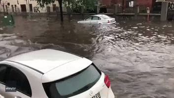 Cars Washed Away as Bus Drives Through Flooded Streets of Belgrade
