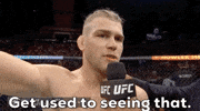 Sports gif. After finishing a match, Jake Matthews gives an interview and bluntly says, "Get used to seeing that."