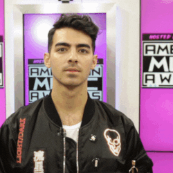 Celebrity gif. Joe Jonas exaggeratedly drags his hands down his jaw-dropped face in utter mock frustration.