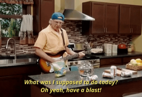 SNL gif. Larry David as Cousin CJ wears a backwards hat and strums an electric guitar while standing behind a kitchen countertop holding a fishbowl; he says, "What was I supposed to do today? Oh yeah, have a blast!" which appears as text.
