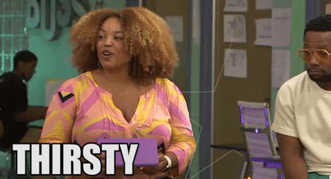 Reality TV gif. A host from Bossip is holding cue cards and she says, "Thirsty Thursdays," excitedly.