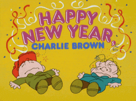 Peanuts gif. In bright purple and blue bubble letters and decorated with red, white, and blue confetti, text reads, "Happy New Year, Charlie Brown." Underneath, Charlie Brown and Linus lie flat on their backs with doodles of fireworks, flowers, and confetti emerging from their heads, as if they're a bit dizzy.