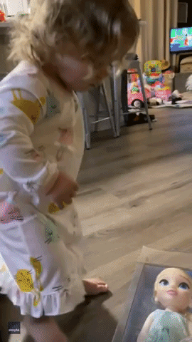 Toddler's Cute Reaction While Opening Presents