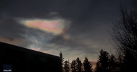Iridescent Clouds Glitter Over Reykjavík