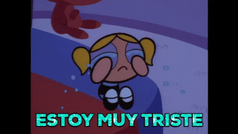 Cartoon gif. Bubbles from Powerpuff Girls sitting on the edge of a bed, hands on her eyes, crying and crying, a glittering message below. Text, "Estoy muy triste."