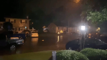 Water Floods Residential Street Amid Severe Thunderstorm Warnings In New Jersey