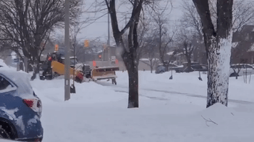 Locals Help Free Plow From Deep Snow as Winter Storm Hits Ontario