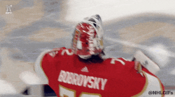 Sports gif. Sergei Bobrovsky of the Florida Panthers skates on the ice and blows a kiss to the crowd.