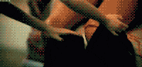 Video gif. Grainy closeup of a Ken doll's pants as they're pulled down cuts to a Barbie with her hands up in triumph.