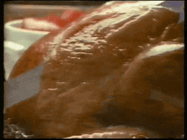 Ad gif. In a vintage Butterball commercial, a juicy turkey is sliced perfectly, and then the slice is pulled away by a pair of tines.