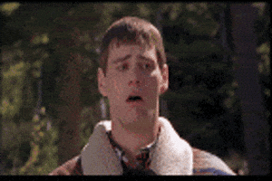Movie gif. Jim Carrey as Lloyd Christmas in Dumb and Dumber realizing until he begins to gag, horrified to revulsion.