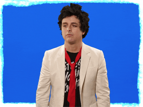 Celebrity gif. Billie Joe Armstrong from Green Day face palms, covering his eyes, and animated action lines appear. 