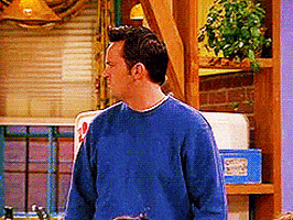 Friends gif. Matthew Perry as Chandler looks confused as he turns his head in a contagion that passes to Courtney Cox as Monica, Jennifer Aniston as Rachel, and David Schwimmer as Ross. They turn their heads as we cut to Matt LeBlanc as Joey looking perplexed and then to Lisa Kudrow as Phoebe who counts Ross, and then herself, before pointing to the empty space beside her.