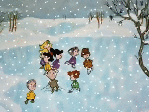 Peanuts gif. Snowy scene from A Charlie Brown Christmas, the kids are all ice skating on a frozen pond.