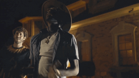 Music video gif. Lil Dicky and Rich Homie Quan in the Save that Money music video stand outside of a nice house at night. They look up to the sky and pray. 