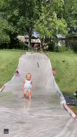 Dad Displays Cat-Like Reflexes as He Catches Toddler on Slip 'N Slide
