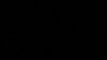 Anime gif. From One Piece: A view from inside a chest, a young Rosinante opens the lid and reaches in to search among countless gold treasures as his parents watch from the background.