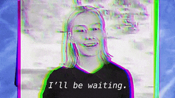 Celebrity gif. Phoebe Bridgers, flashing spottily from within in a stylized, artificial found-footage screen says "I'll be waiiiiiiiting."