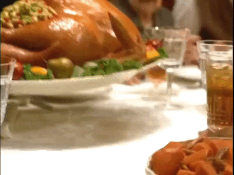 Video gif. A perfect roast turkey is set in front of us.