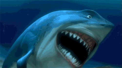 Cartoon gif. Bruce the shark from Finding Nemo laughs loudly, showing his sharp teeth as he does.