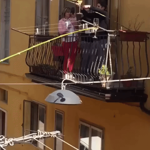 Cheers From a Distance: Italian Neighbors Enjoy Drinks From Separate Balconies