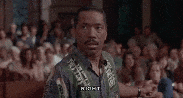 Movie gif. Obba Babatunde the interpreter in Born To Be Wild, sits on a bench pointing at a crowd behind him, as he gives someone a serious look and says, "Right."