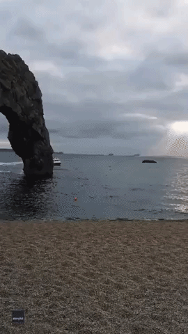 World Record Holder Uses Jetpack to Swoop Through Sea Arch
