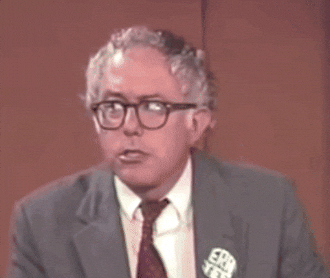 Political gif. A younger Bernie Sanders listens to us, and raises his eyebrows in a response that seems to say "I read you loud and clear."